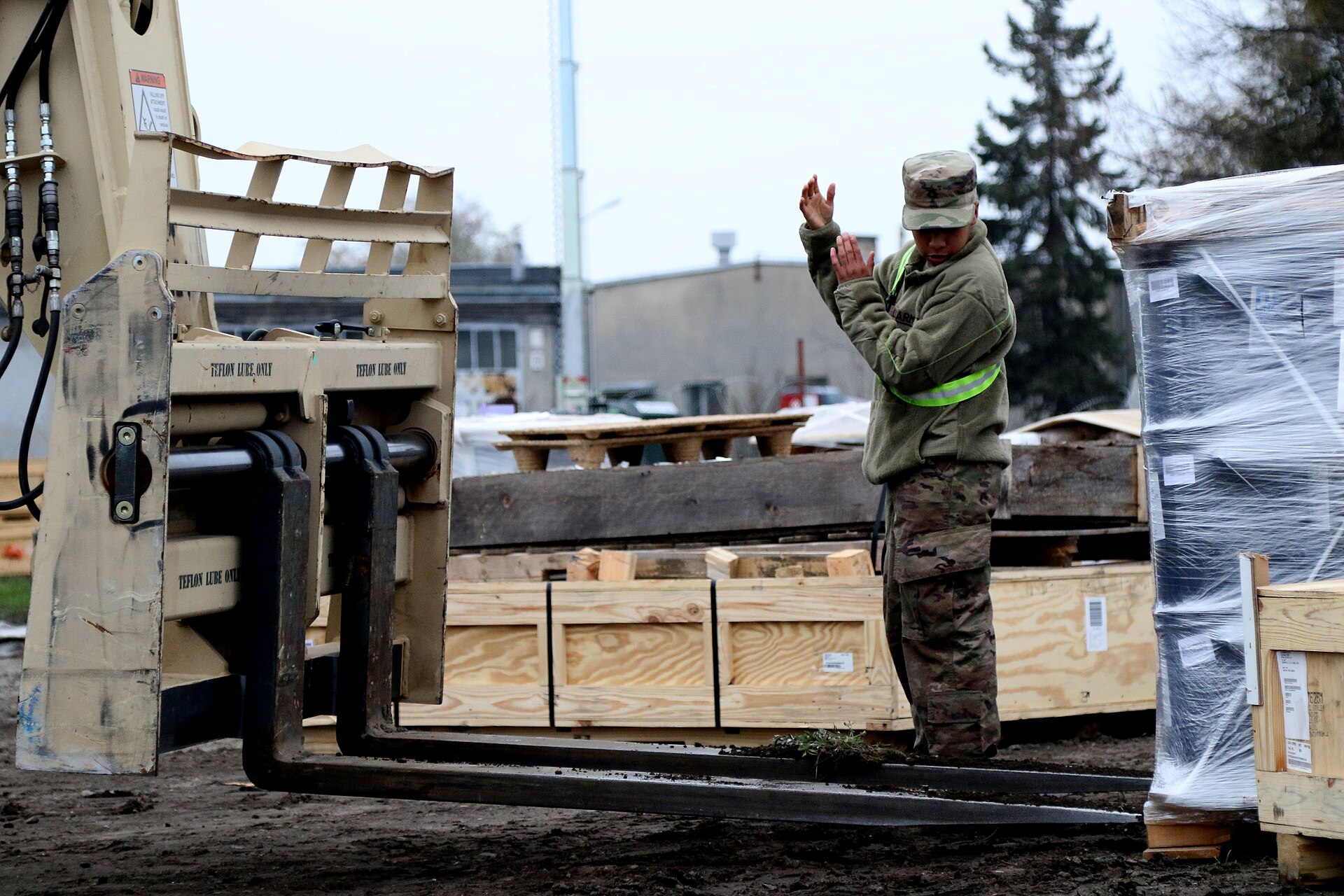 Shrink-wrapped crates on pallets in a supply depot