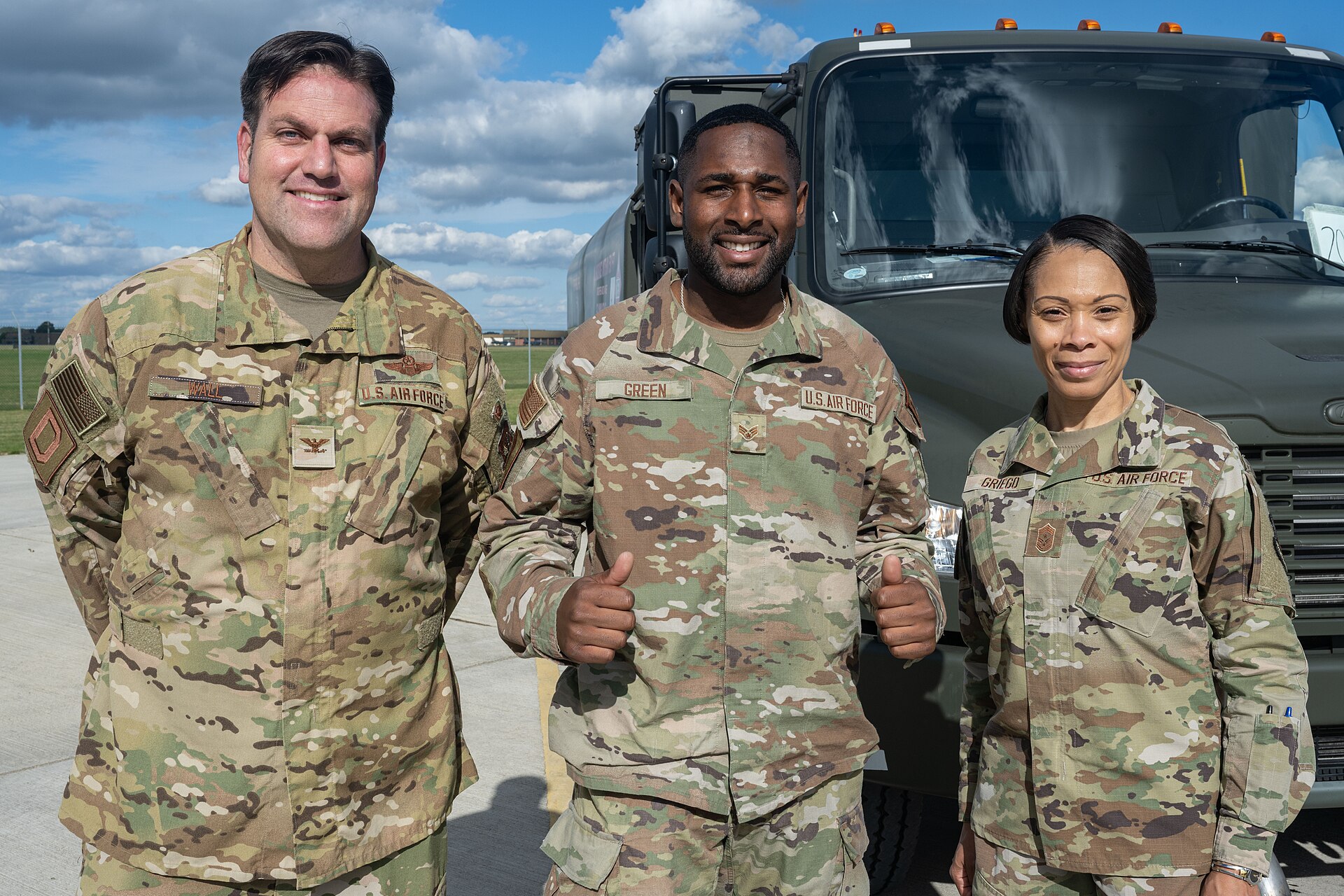 A logistics crew in front of a truck